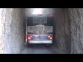 Bus drives through the tunnel on the Needles Highway