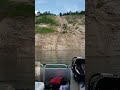 2 guys falling down steep hill and sleeping bear dunes into water into water