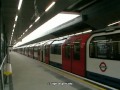 Central Line train doors open both sides.