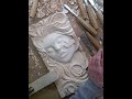 Wood Carved portrait of a girl's face