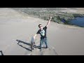 James Hatchett tries sand sledding