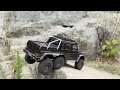 Traxxas TRX6 and TRX4 Sport hit canyon gap jump while rock crawling