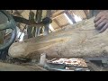 the process of cutting old teak wood that has been piled up for decades