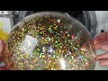 Experiment - Balloon with Golden Confetti - in a Washing Machine