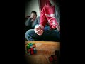 13 year old boy does multiple rubik cube puzzles