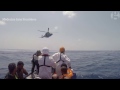 Mediterranean migrant crisis: search & rescue boat plucks migrants from sea