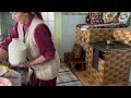 One day of rural life of grandma high in the mountains of Ukraine. Making threads from sheep's wool.