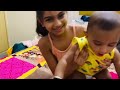 Cute baby playing with sister