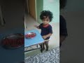 Kid eating pomegranate