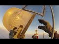 Changing a Bulb Atop a 2000 Ft Tower Looks As Crazy As It Sounds ...