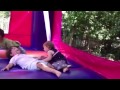 Harper (13 months) & Riley in bounce house