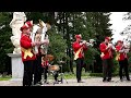 A brass band under the lindens of the Pavlovsk park.