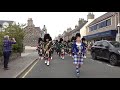 Drum Majors flourish during Huntly Pipe Band's 70th anniversary parade , Scotland, Sept' 2018