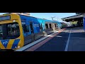 Busy train station at Caulfield in Vic, Aust. Surprise diesel 'City of Warnambool' pulls passengers.