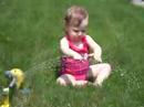 Mackenzie in the sprinkler