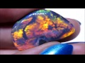 Black Opal 'Glowing Embers' cut from rough to a polished stone